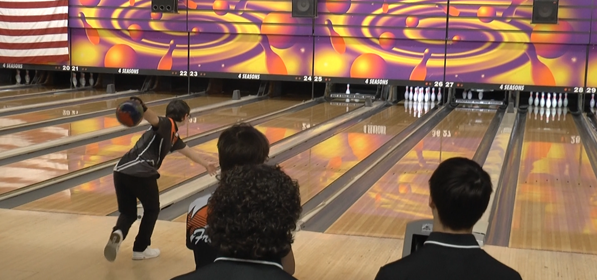 Trevor Veer rolls a bowling ball during a competition at the Four Seasons Bowling Center