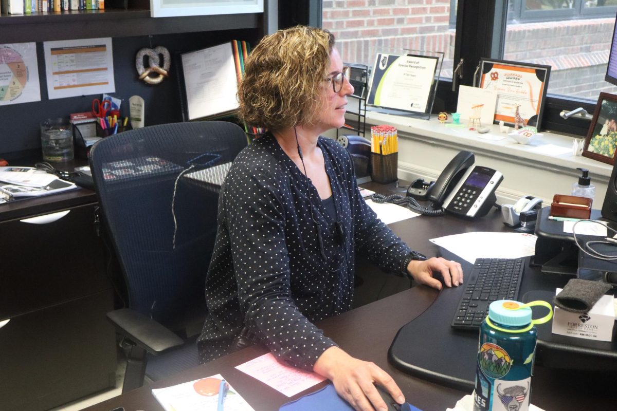 Associate Principal Rosemarie Brubaker works in her office