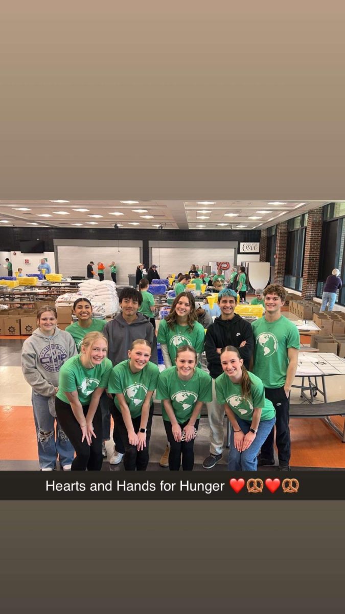 Servant Leadership packs meals for Hearts and Hands for Hunger in 2025