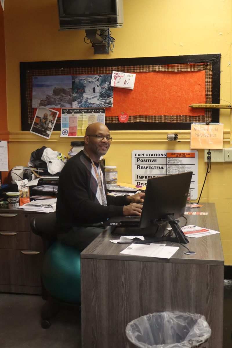 TJ Jackson poses for a photo in his office