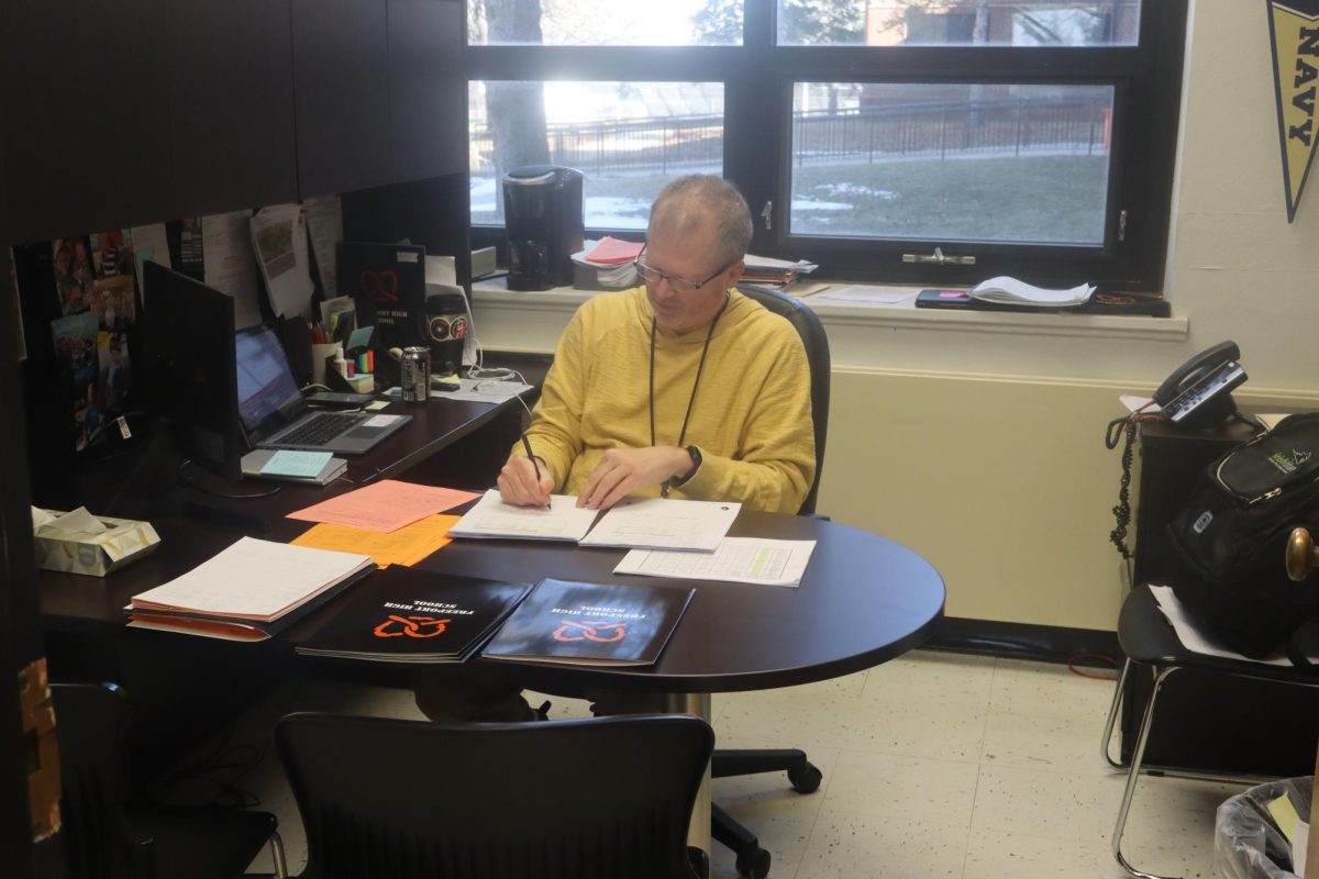 Paul Heimer works to catch up on work from class registration