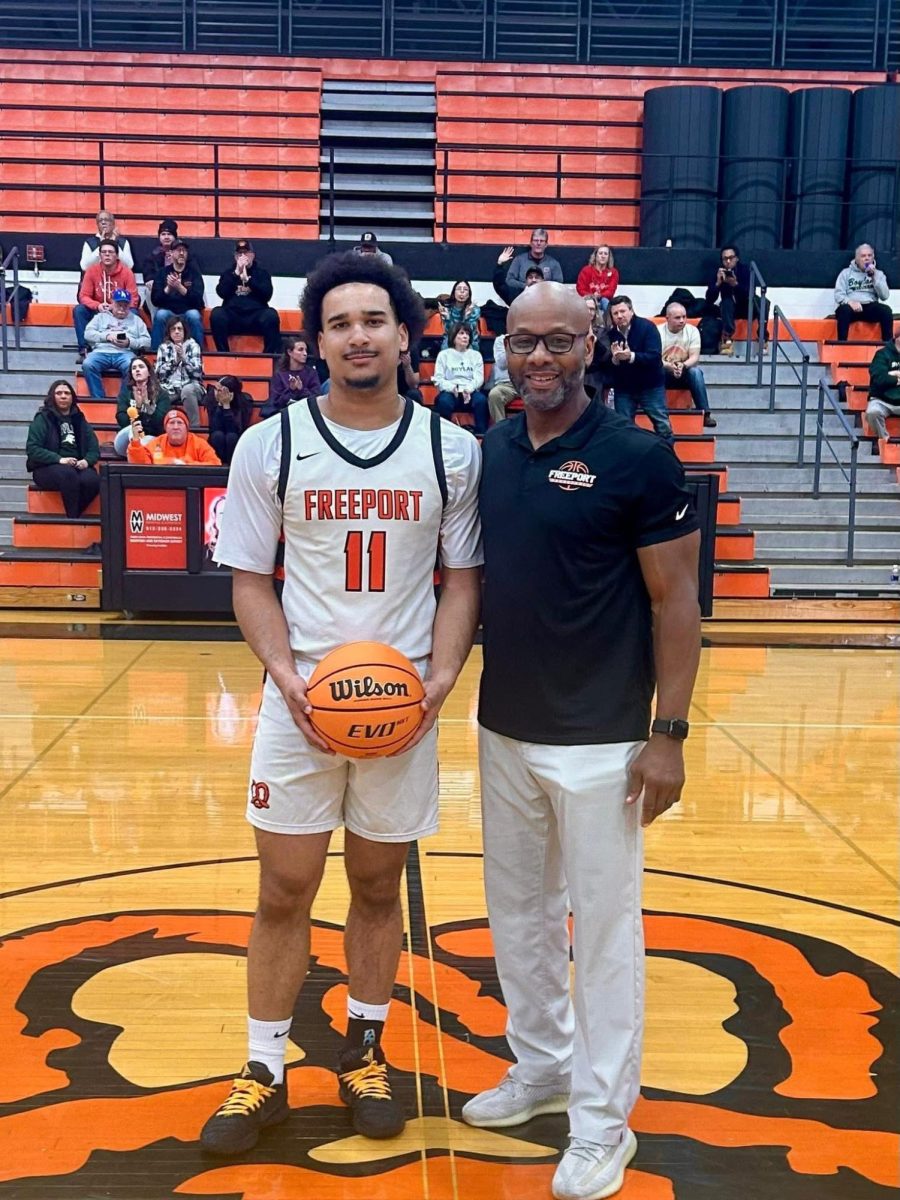 Andrew Seward poses for a photo with TJ Jackson after celebrating 1000 points during Boylan game on the 6th.